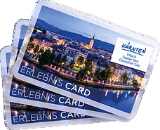 Drei Kärnten Erlebnis Cards mit nächtlicher Stadtansicht, ideal für Erkundungen in Villach, Faaker See und Ossiacher See.